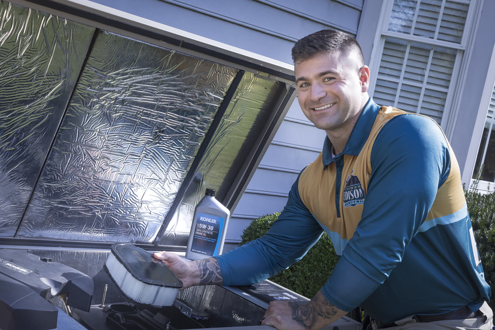 A standby generator installed beside a home